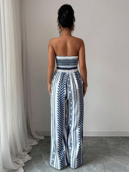 Vaelisse — Halter-Neck Jumpsuit mit geometrischem Druck und seitlichem Schlitz